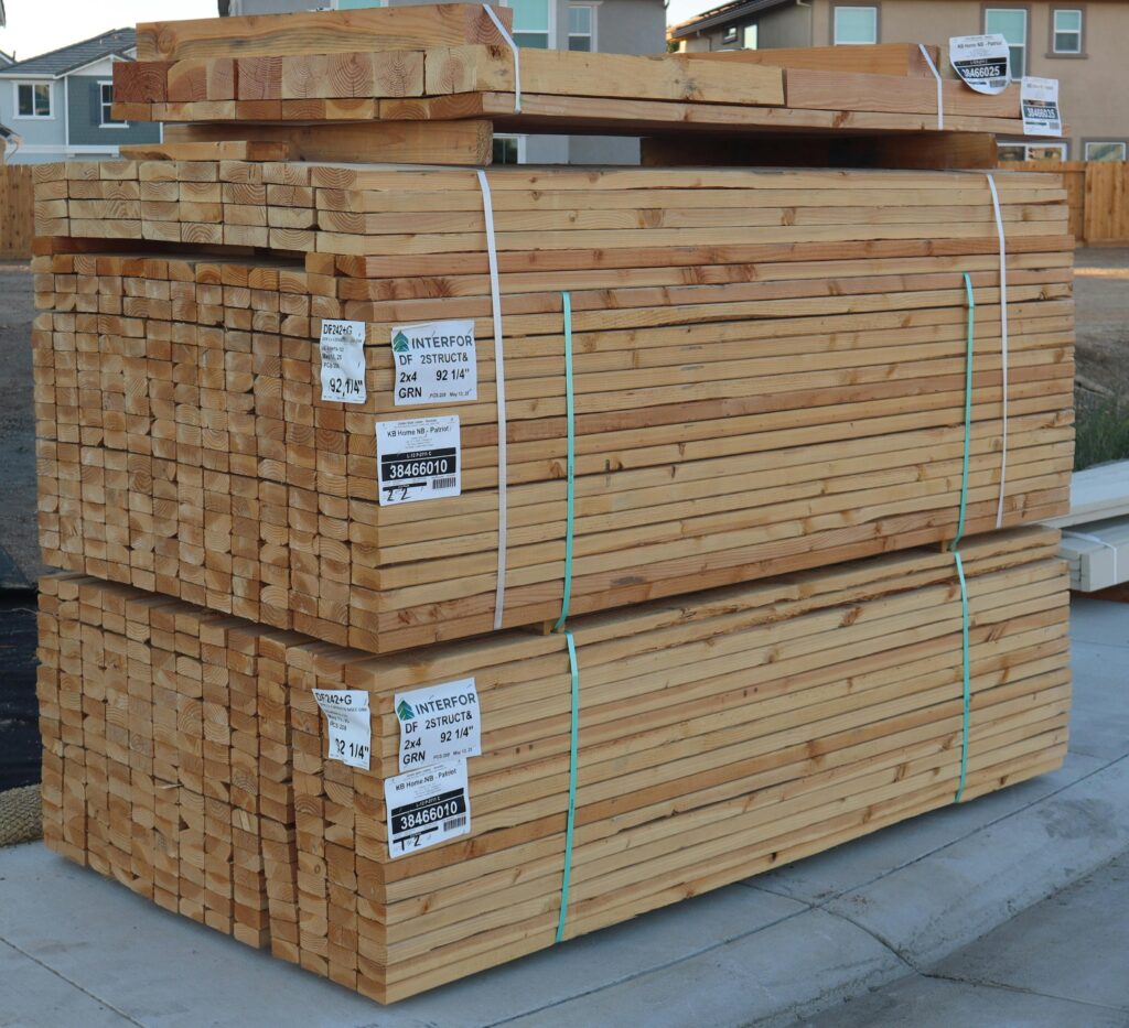 pexels photo 33043875 33043875 Neatly stacked lumber ready for home construction in Elk Grove, CA.