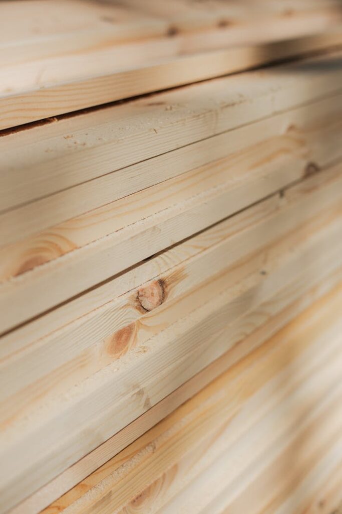 pexels photo 8817831 Close-up view of neatly stacked wooden planks highlighting their natural texture and grain.